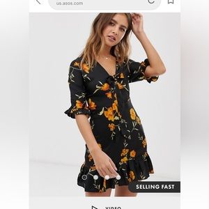 Satin dress with a ribbon tie detail in the front.